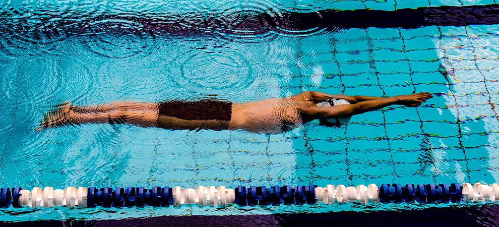 person swimming for health benefits